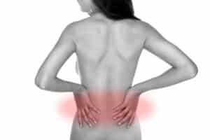 Woman with back pain before breast reductio in San Antonio, TX